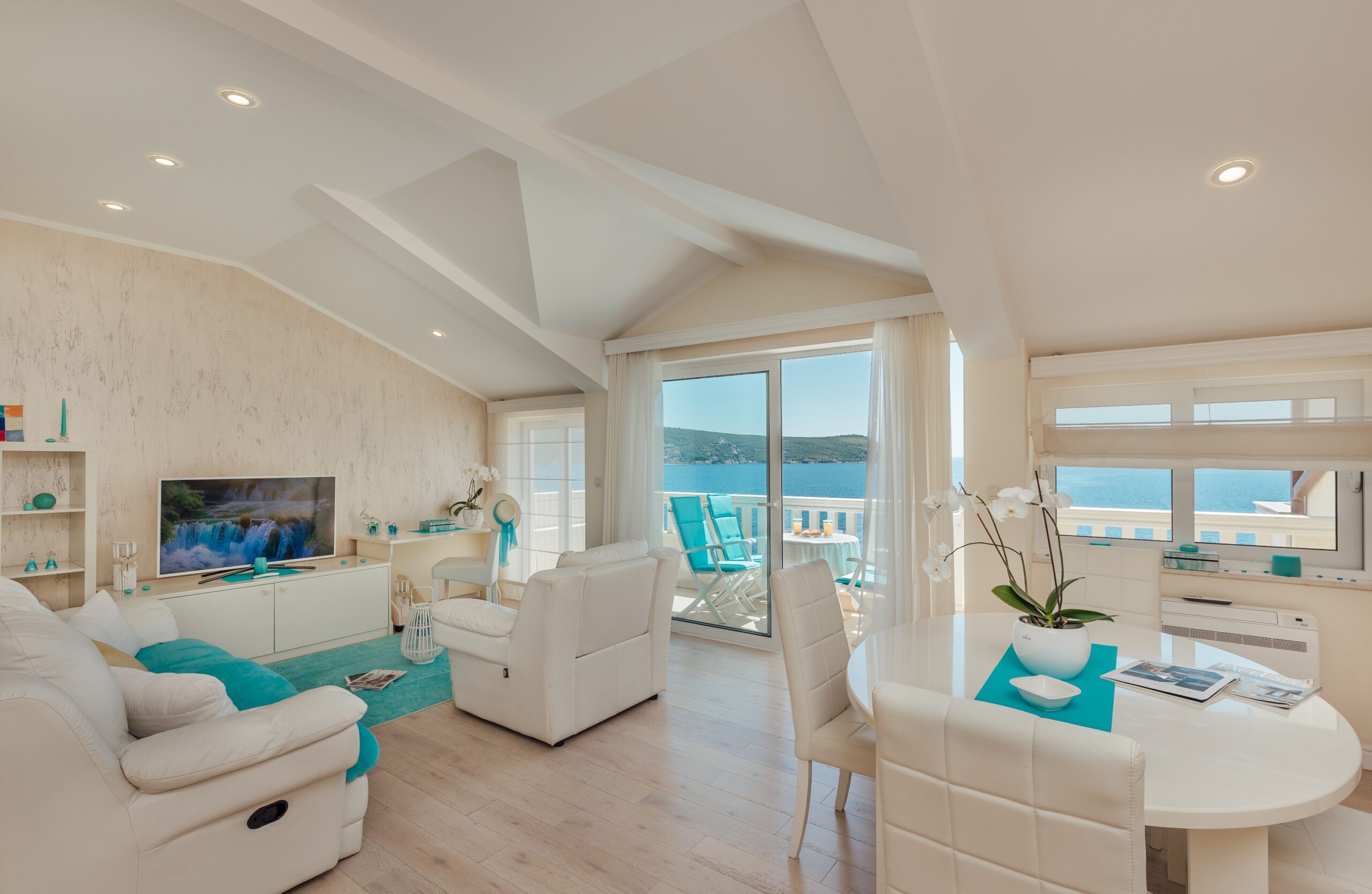 Living room and dining area with beautiful sea view